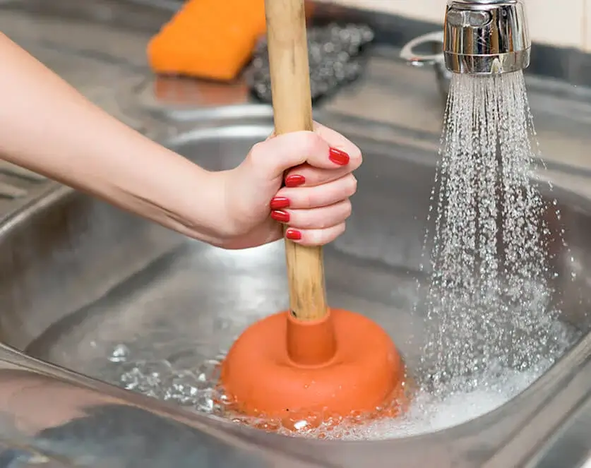 woman with a plunger | Flowtec